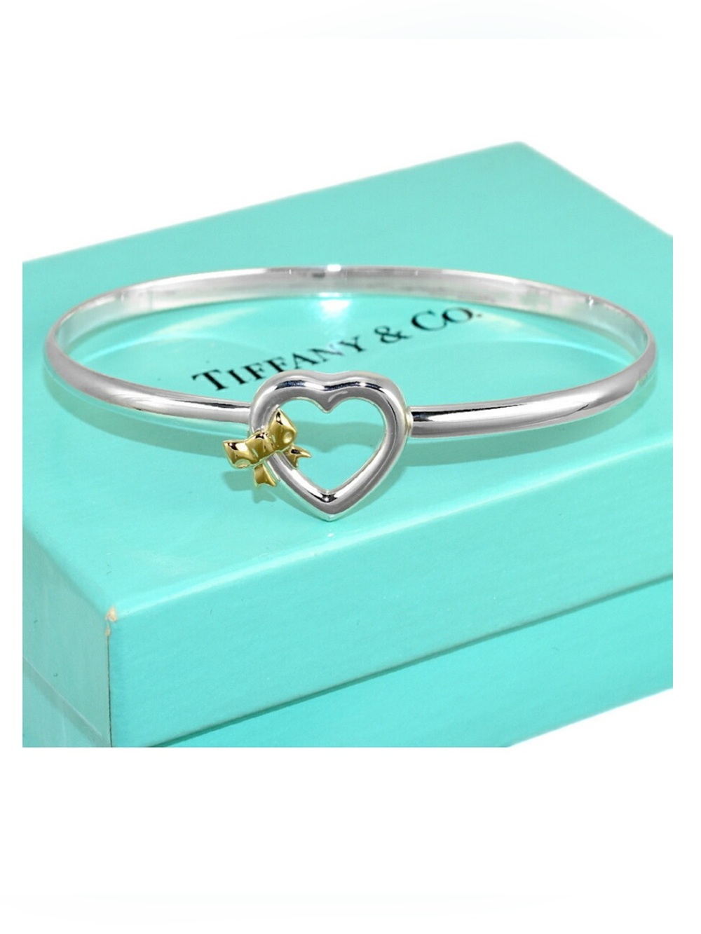 Tiffany & Co. Silver Heart Bangle with Gold Bow Accent